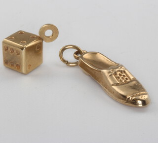A 9ct yellow gold loafer charm and a ditto dice charm 1.4 grams