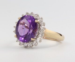 A 9ct yellow gold amethyst and diamond cluster ring size P 