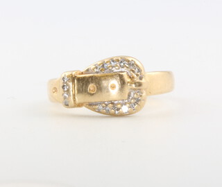 A 14ct yellow gold diamond set buckle ring, 3.9 grams, size K 1/2