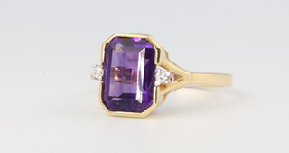 An 18ct yellow gold amethyst and diamond ring, size P