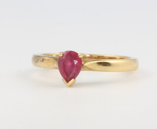 An 18ct yellow gold pear cut ruby ring, size O, 3.8 grams