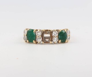 A 14ct yellow gold emerald and diamond ring, 2.6 grams, size O 