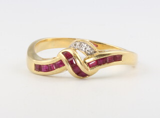 An 18ct yellow gold cross-over ruby and diamond ring, 3.9 grams, size T 