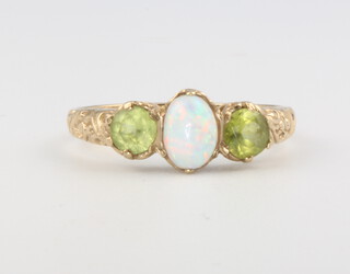 A 9ct yellow gold opal and peridot ring size N, 2.2 grams 