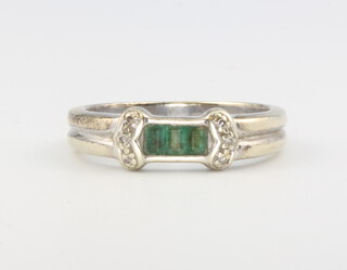 A 9ct white gold emerald and diamond ring, size N, 3.6 grams