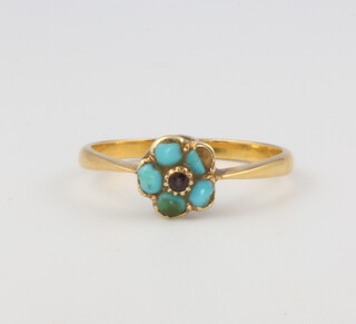 An 18ct yellow gold ruby and turquoise cluster ring size L 1/2, 2.1 grams