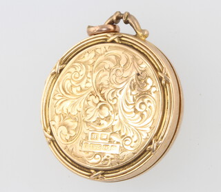 A 9ct yellow gold engraved circular locket, 7.3 grams 