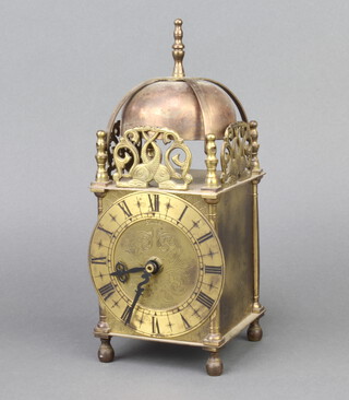 A Smith lantern clock contained in a gilt metal case with battery operated movement 44cm h x 10cm w x 10cm d 