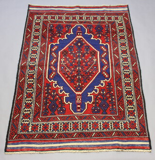 A red, blue and white ground Ghalmri Kilim rug with central medallion 197cm x 138cm 