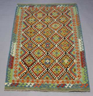 An orange, green and turquoise ground Chobi Kilim rug with 22 diamonds to the centre within a 2 row border 187cm x 124cm 