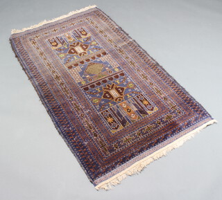A blue and brown ground Belouche rug, the central medallion within a multi row border 144cm x 89cm 
