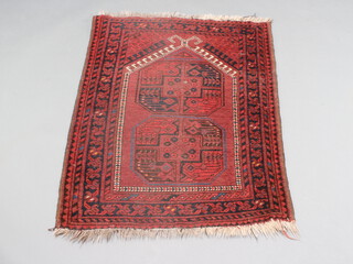 A red and blue ground Afghan rug with 2 octagons to the centre 109cm x 78cm 