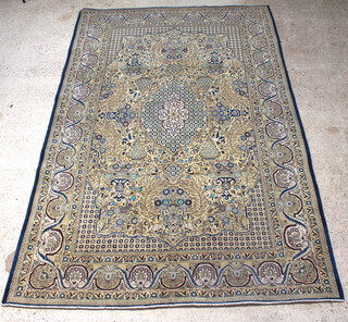A yellow and green ground Qum carpet with central medallion 321cm x 208cm 