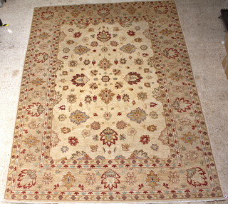 A contemporary yellow and brown ground Caucasian style floral patterned carpet 355cm x 273cm  
