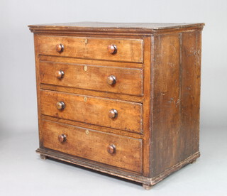 An 18th Century elm chest with hinged lid, fitted 4 drawers with tore handles, raised on square supports 103cm h x 112cm w x 64cm d