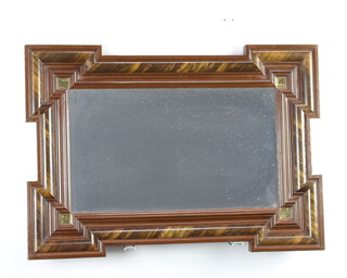 A Dutch style rectangular plate mirror contained in a geometric moulded frame with simulated tortoiseshell panels 51cm x 72cm 