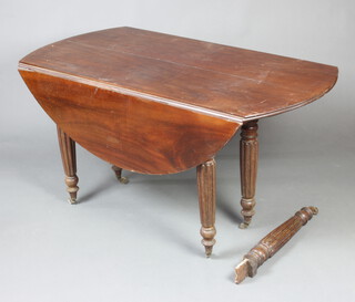 A 19th Century mahogany oval drop flap extending dining table raised on 6 turned and fluted supports 70cm h x 145cm w x 73cm l when closed