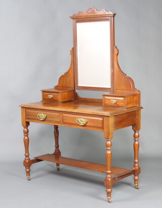 An Edwardian mahogany dressing table with rectangular mirror, the base fitted 2 glove drawers above 2 long drawers, raised on turned supports with H framed stretcher 164cm h x 104cm w x 50cm d 