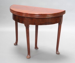 A Georgian mahogany demi-lune triple flap tea/card table, raised on club supports  74cm h x 90cm w x 45cm d, the card table section with 6 counter wells 