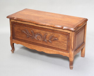 A French carved oak coffer with hinged lid, raised on cabriole supports 49cm h x 88cm w x 40cm d 