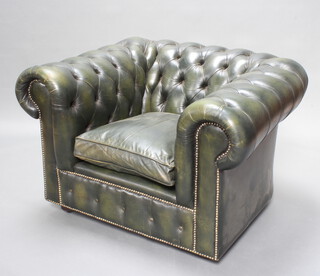 A Chesterfield armchair upholstered in green buttoned leather 