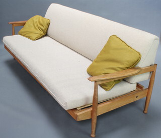 A mid Century teak folding studio couch, the back incorporating storage 75cm h x 184cm w x 80cm d 