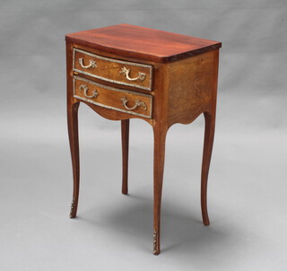 A French 19th Century bow front mahogany bedside table fitted 2 long drawers, raised on cabriole supports with gilt metal mounts throughout 65cm h x 42cm w x 31cm d 