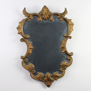 An Italian style shaped plate wall mirror contained in a painted gilt frame 57cm x 41cm 