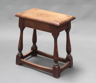 A 19th Century oak joined stool raised on turned and block supports with box framed stretcher 48cm h x 46cm w x 27cm d 