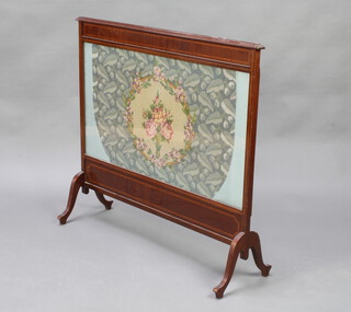 An Edwardian rectangular inlaid mahogany fire screen with Berlin woolwork panel, raised on cabriole supports 75cm h 