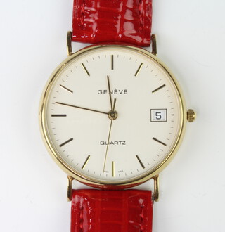A gentleman's 9ct yellow gold Geneve calendar quartz wristwatch on a leather strap 