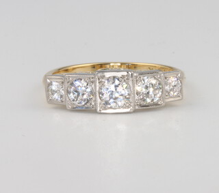 An 18ct yellow gold and platinum 5 stone graduated diamond ring, size N 