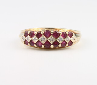 A 9ct yellow gold ruby and diamond ring size Q