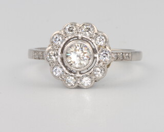 A platinum diamond cluster ring 0.7ct, size M 1/2