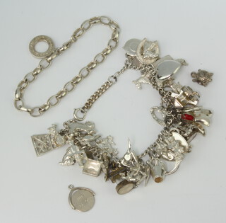 A silver charm bracelet and minor silver jewellery 100 grams