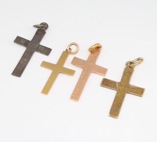 Two yellow gold cross pendants and 2 others, 4 grams 