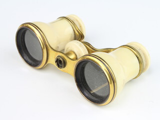 V Curvilinear, a pair of opera glasses in gilt metal and ivory case (some damage to the ivory and 1 lens cracked) 