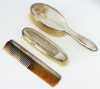 A silver dressing table set comprising comb, clothes brush and hair brush Chester 1921