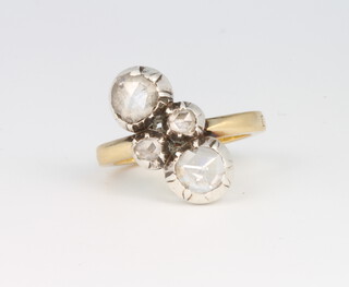 An 18ct yellow gold crossover mine cut diamond ring with 2 larger stones enclosing 2 small stones approx. 1ct, size N 1/2