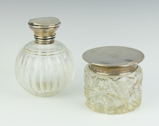 A cylindrical cut glass dressing table jar (f) with silver lid Birmingham 1919 and a cut glass globular shaped scent bottle with silver stopper Birmingham 1932 