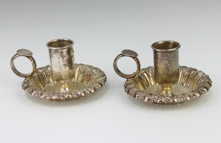 A pair of Portuguese silver chamber sticks with fancy rims, 165 grams