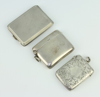 A silver vesta case Birmingham 1919, 1 other and a match sleeve 105 grams 