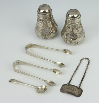 A George III whisky label, 2 pairs of tongs, a spoon and a pair of 800 condiments 