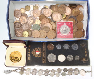 A silver gilt commemorative 1977 crown and minor coinage including a coin bracelets 