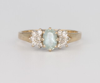 A 9ct yellow gold aquamarine and diamond ring 2.1 grams, size L 