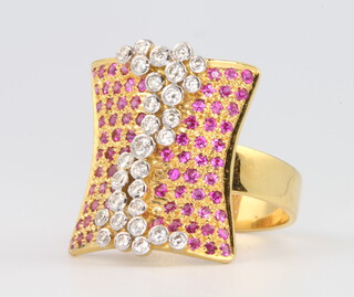 A stylish 18ct yellow gold ruby and diamond dress ring size N, 10.1 grams