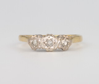 An 18ct yellow gold 3 stone diamond ring 2.5 grams, size M 