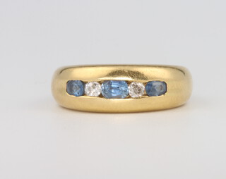 An 18ct yellow gold diamond and sapphire ring, 10.3 grams, size N 