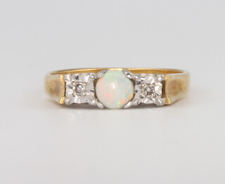 An 18ct yellow gold opal and diamond ring 4.2 grams, size O 1/2