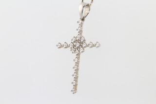 An 18ct white gold paste set cross pendant and chain 4.1 grams 